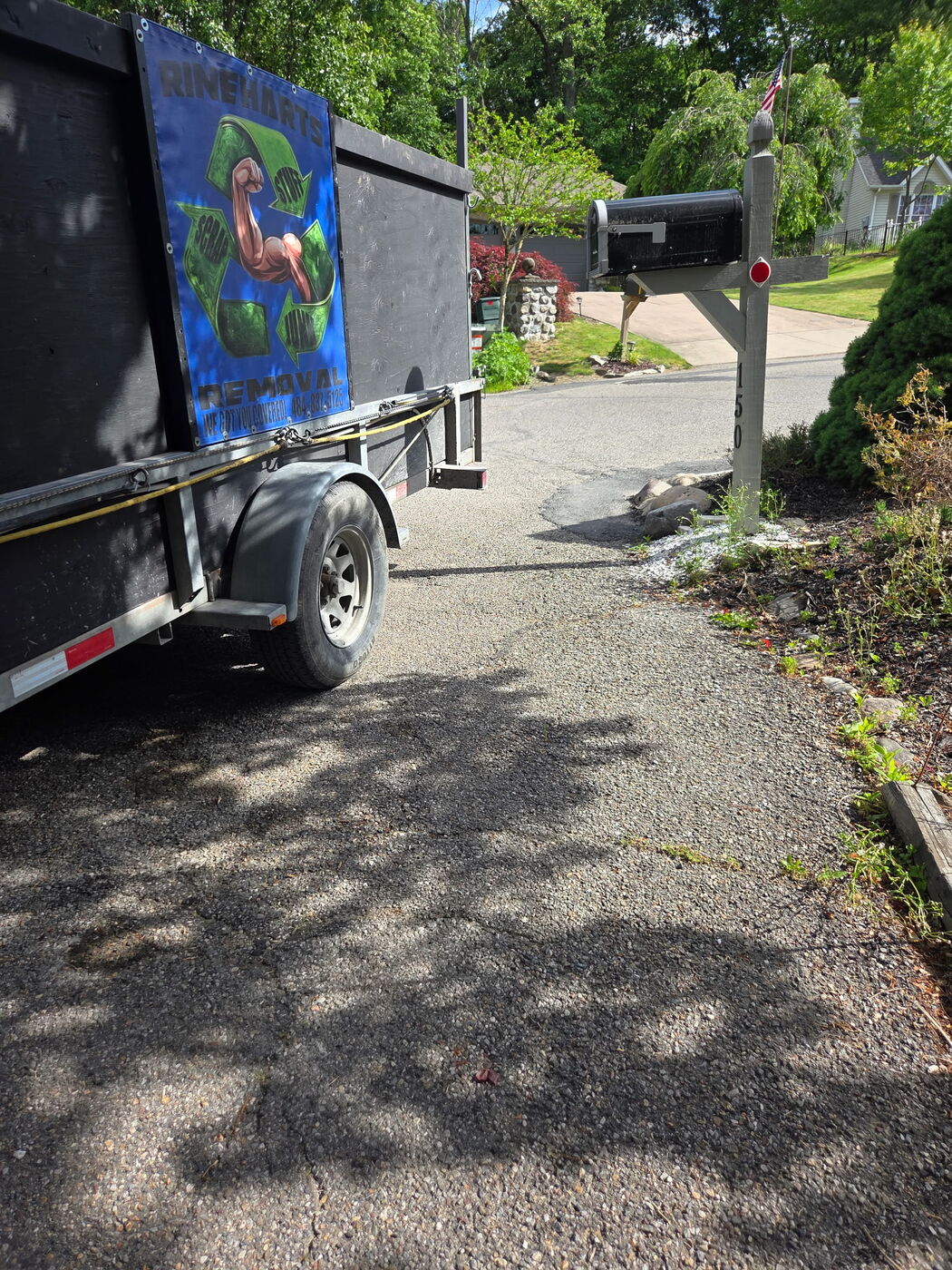 Rineharts Removal trailer on the job